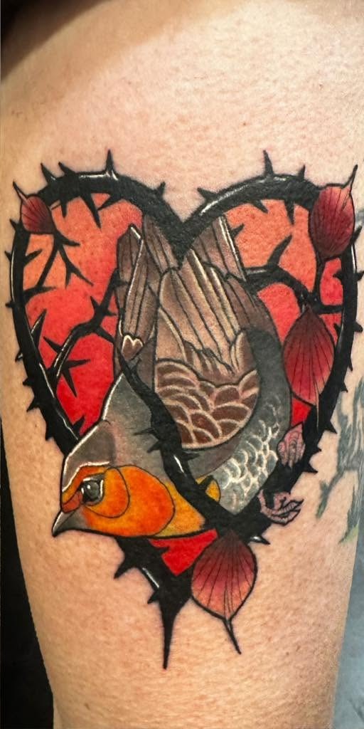 Color piece of praying hands and a bird inside a thorned heart