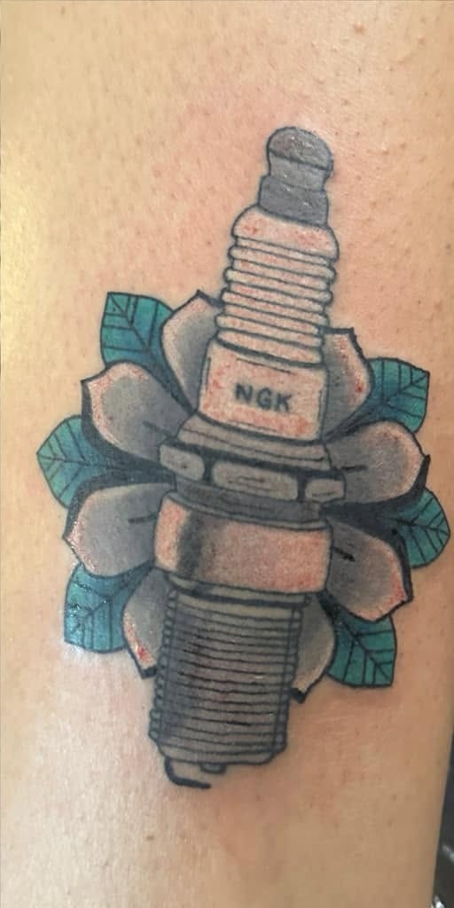 Color spark plug set inside open petals